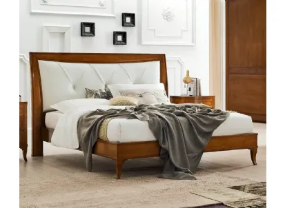 Letto Aurora in legno con testiera in pelle di Le Fablier