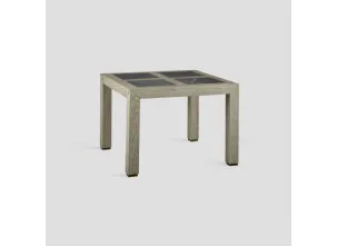 Tavolo quadrato Agorà Stone realizzato in legno massello di Conifera lavorato a mano con top con inserti in grès porcellanato finitura Pietra di Dialma Brown